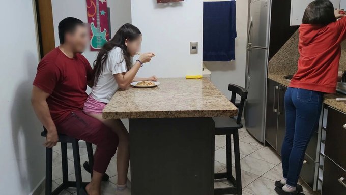 18-Year-Old Latina Enjoys Eating While Sitting On Man'S Legs