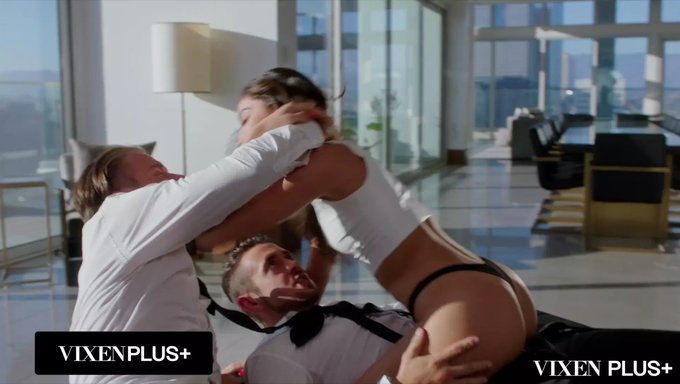 Her Lips Wrap Around One Cock While The Other Pounds From Behind